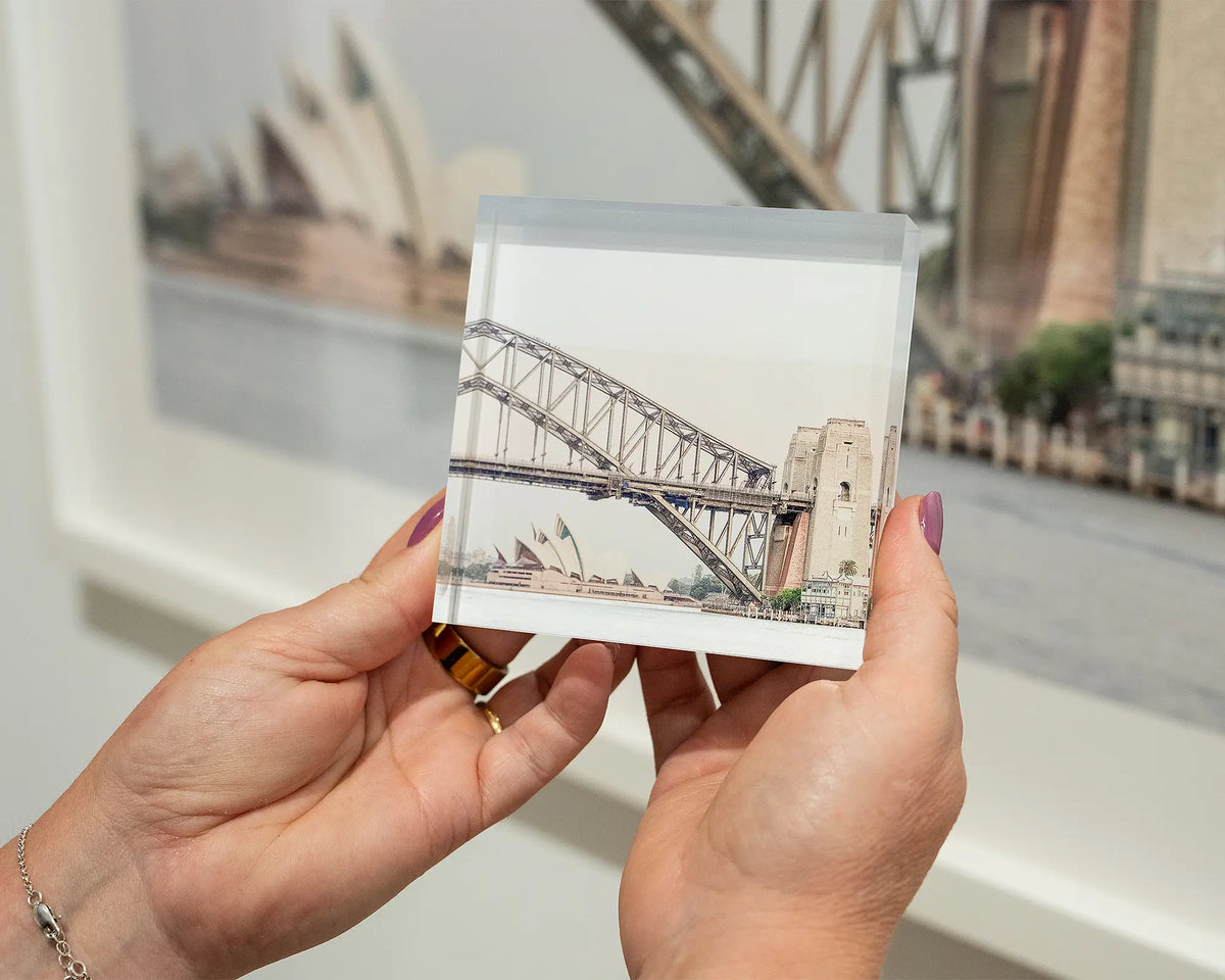 Sydney Icons. Acrylic block of the Opera House and Harbour Bridge, hand held in gallery.