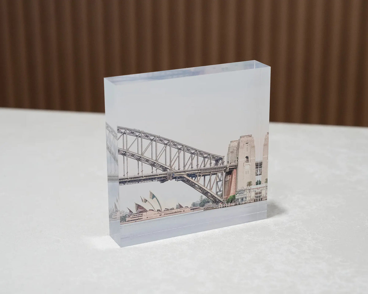 Sydney Icons. Acrylic block of Sydney Opera House and Harbour Bridge, sitting on a desk.