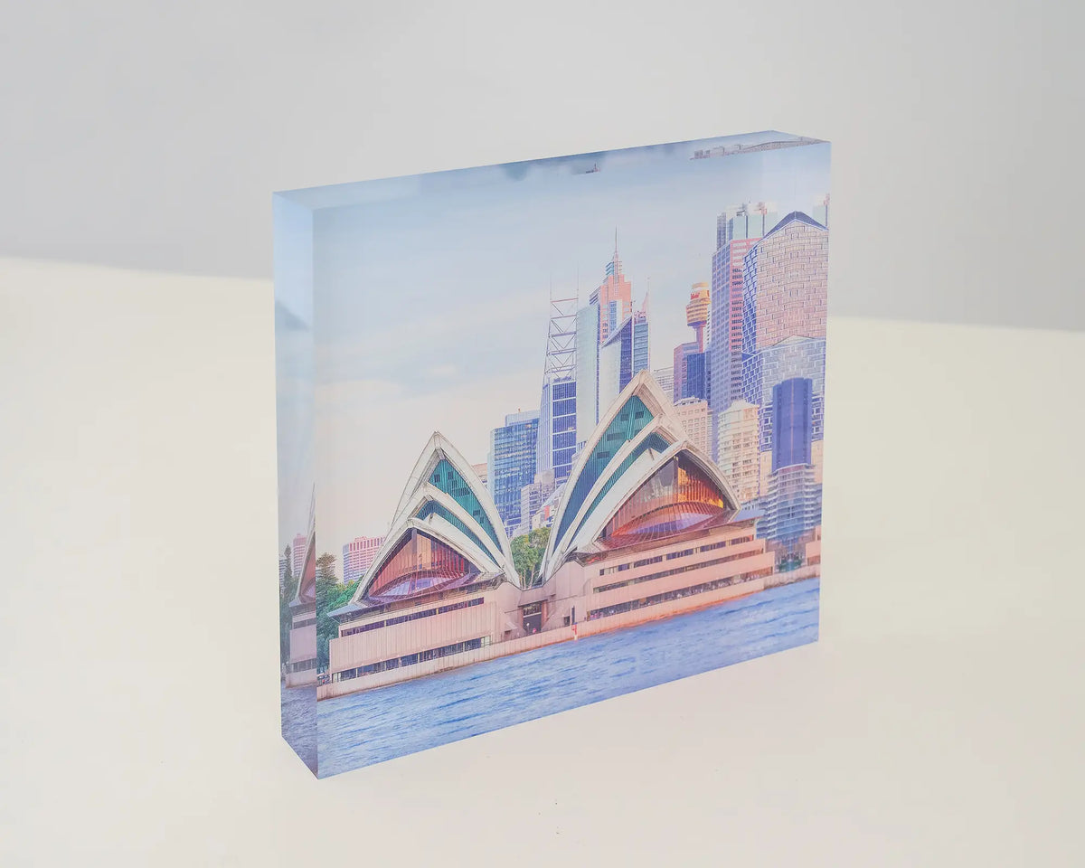 Sydney Views. Acrylic block of the Opera House at sunset, sitting on a desk.