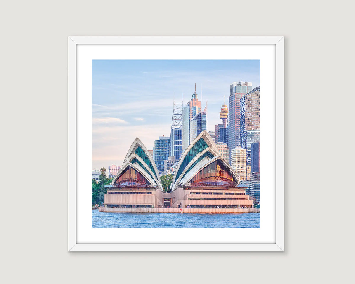 Framed artwork of the Sydney Opera House and CBD skyline on a light grey background.