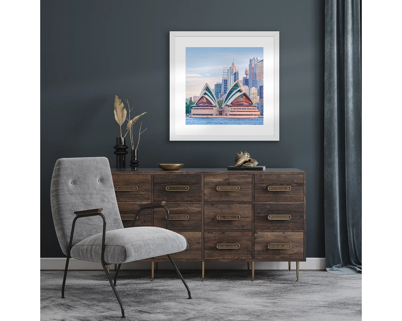Framed artwork of the Sydney Opera House and CBD skyline on a light grey background.