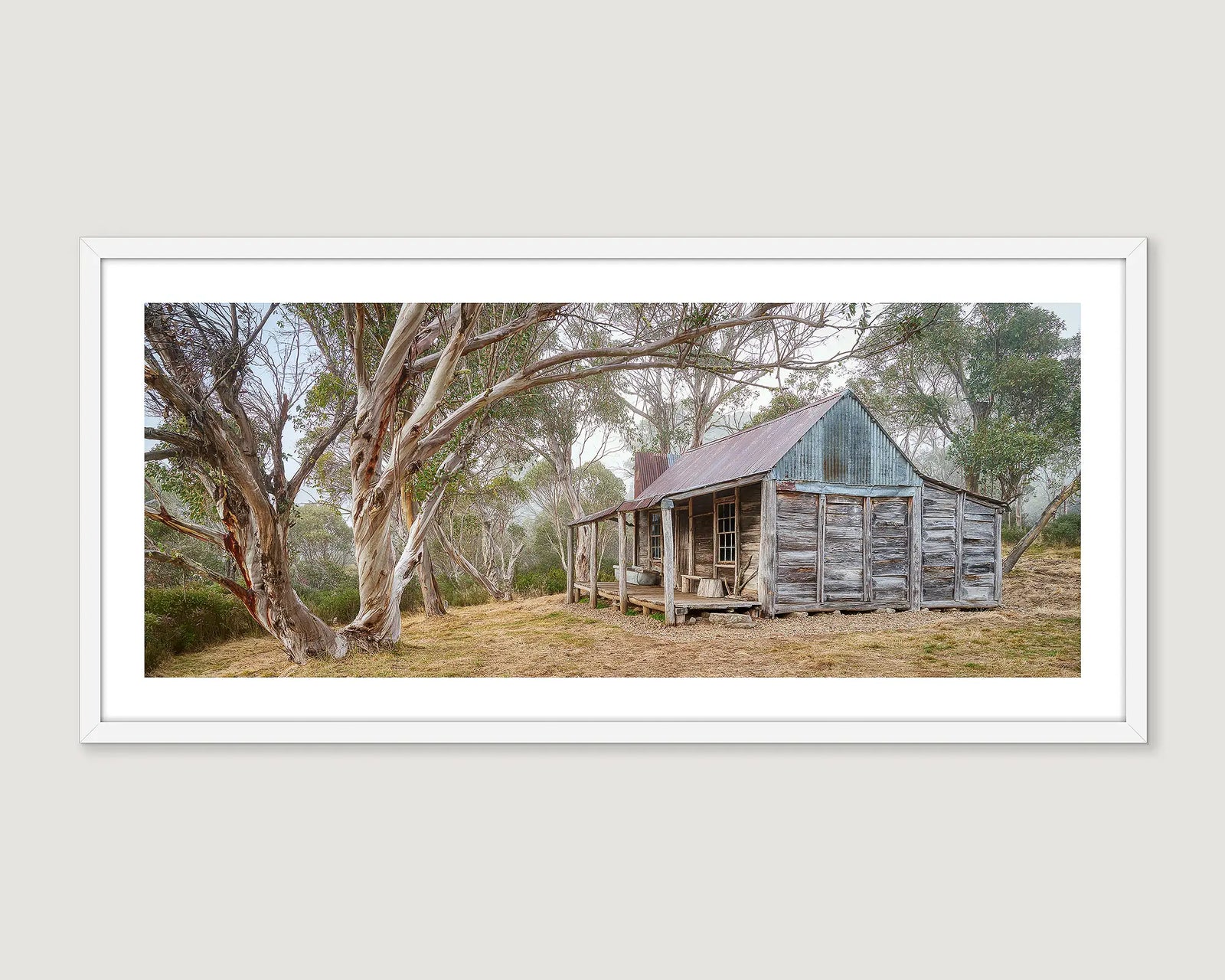 Wheelers Hut wooden cabin in a forest setting with a white frame.