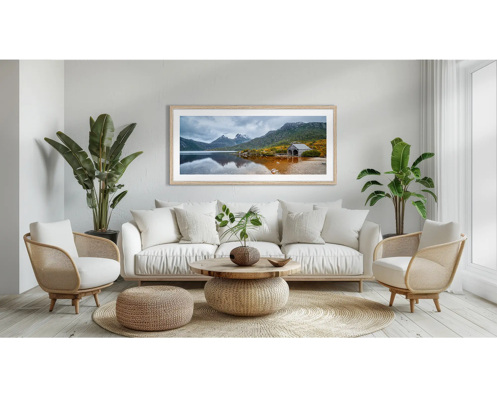 Framed photograph of a mountain landscape with a lake and wooden cabin at Cradle Mountain-Lake St Clair.