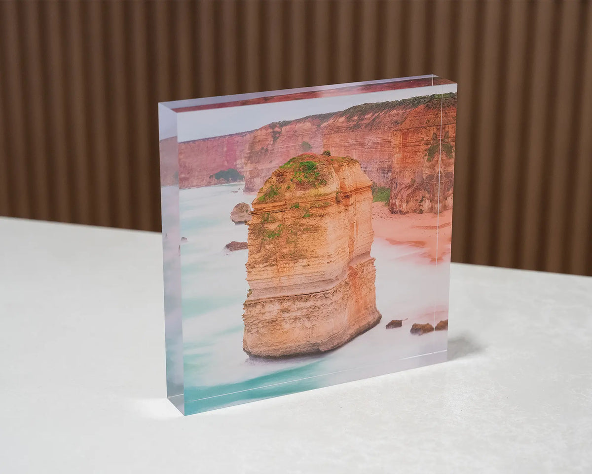 The Apostle. Acrylic block Twelve Apostles, Great Ocean Road, Victoria, sitting on a desk.