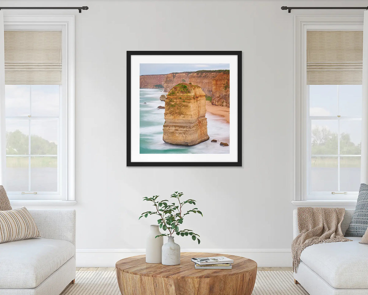 The Apostle. Great Ocean Road wall art print with a black frame hung in a lounge room. 