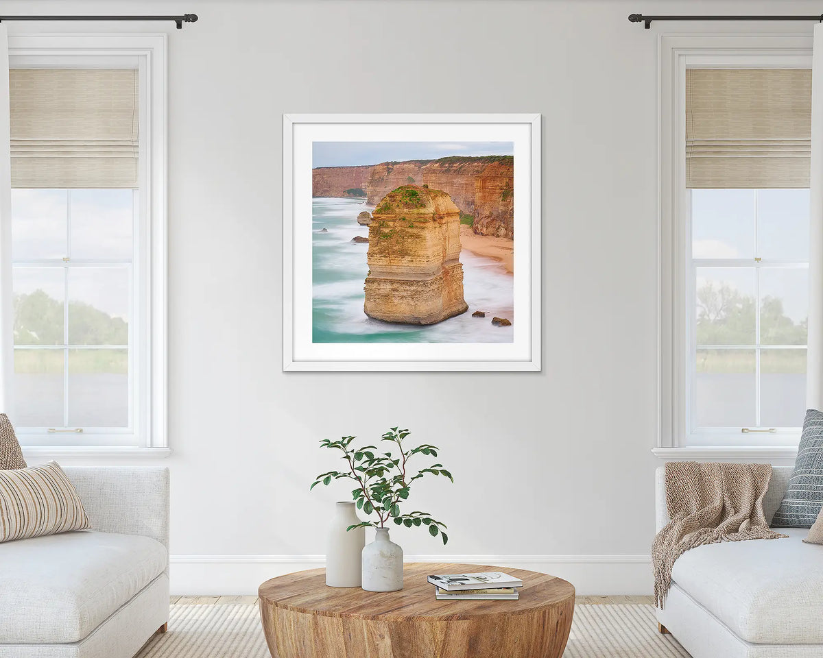 The Apostle. Great Ocean Road wall art print with a white frame hung in a lounge room. 