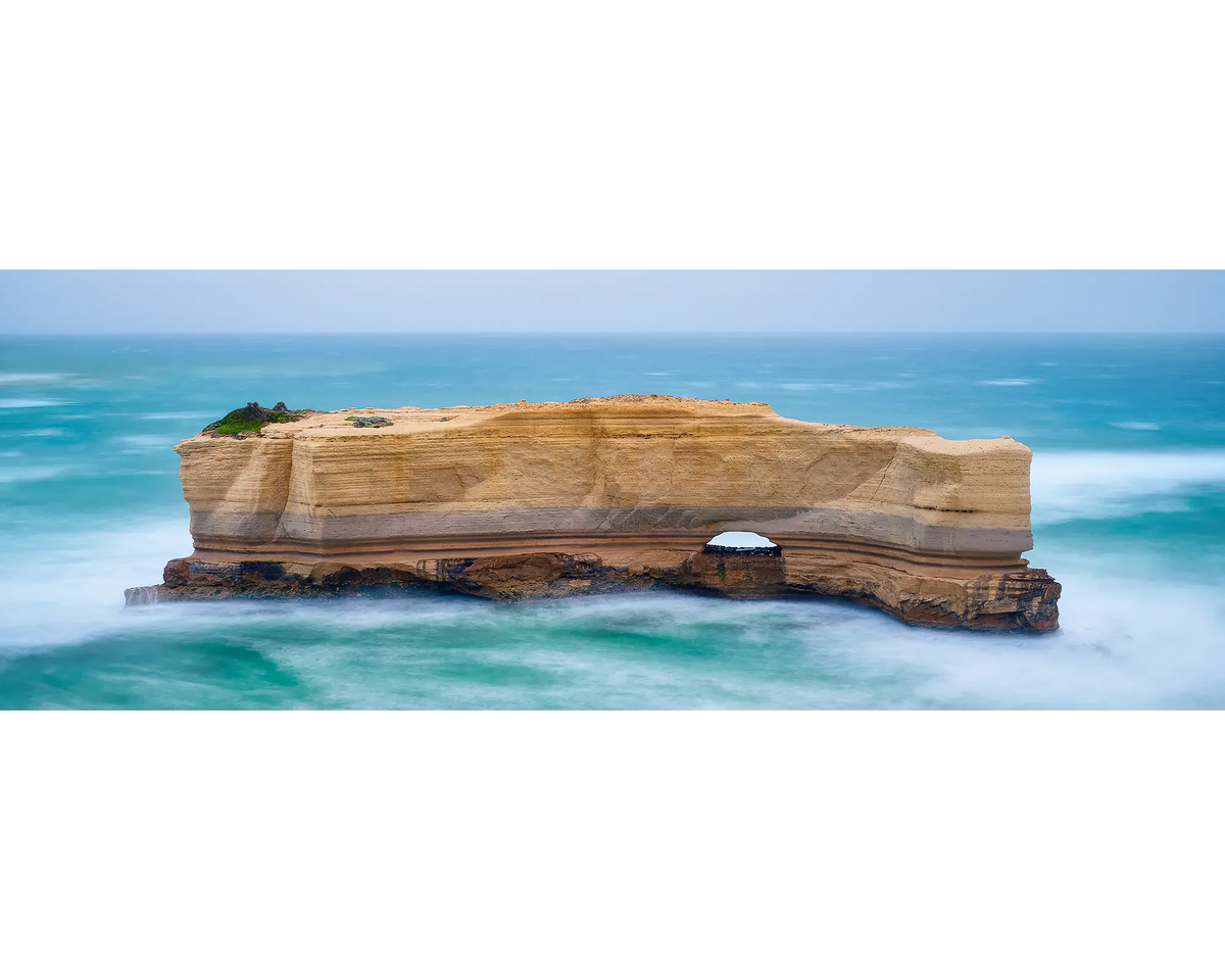 The Bakers Oven rock formation, Great Ocean Road, in the middle of the Southern Ocean with a clear sky,