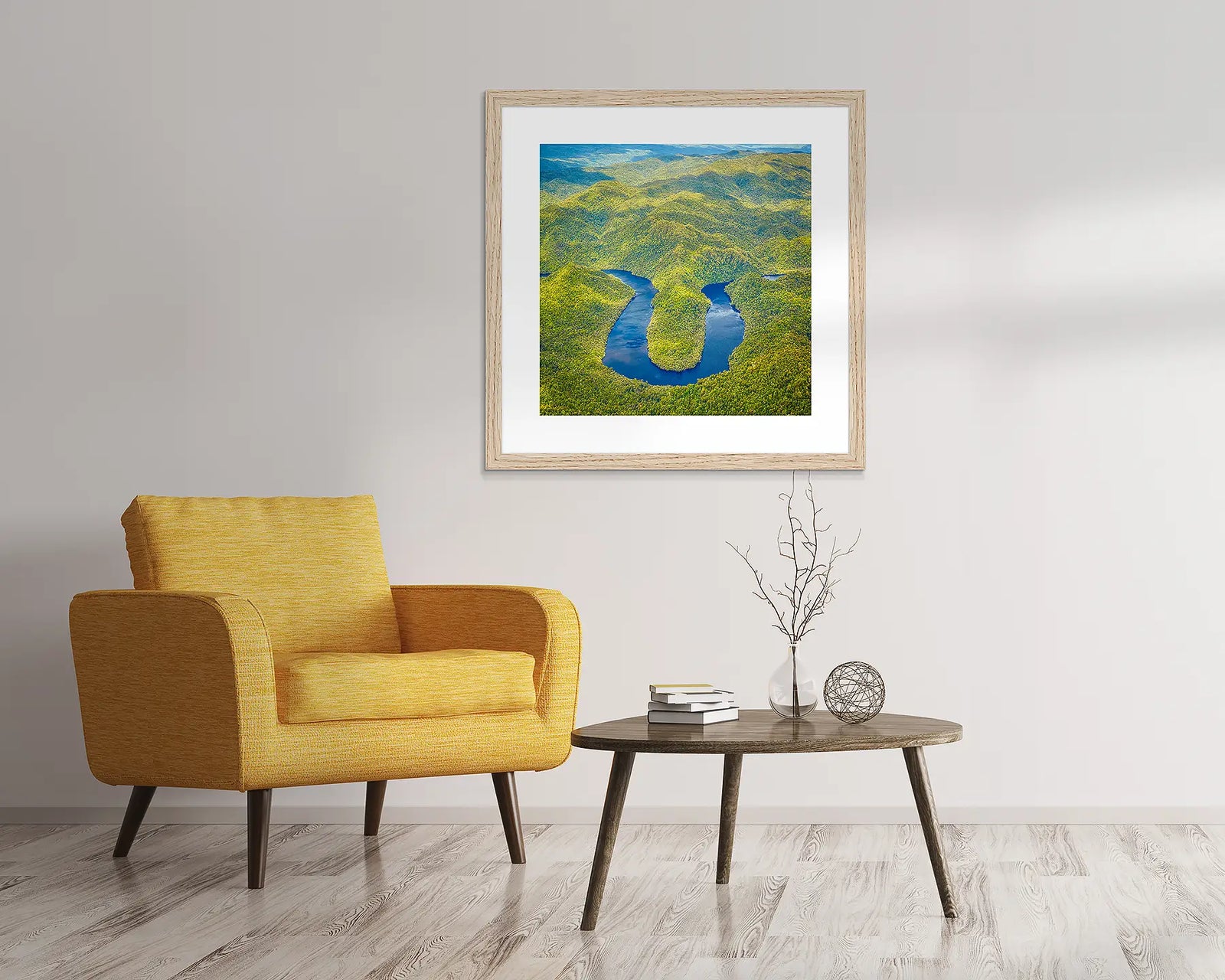 Framed aerial view of a river meandering through a green landscape on the Gordon River.