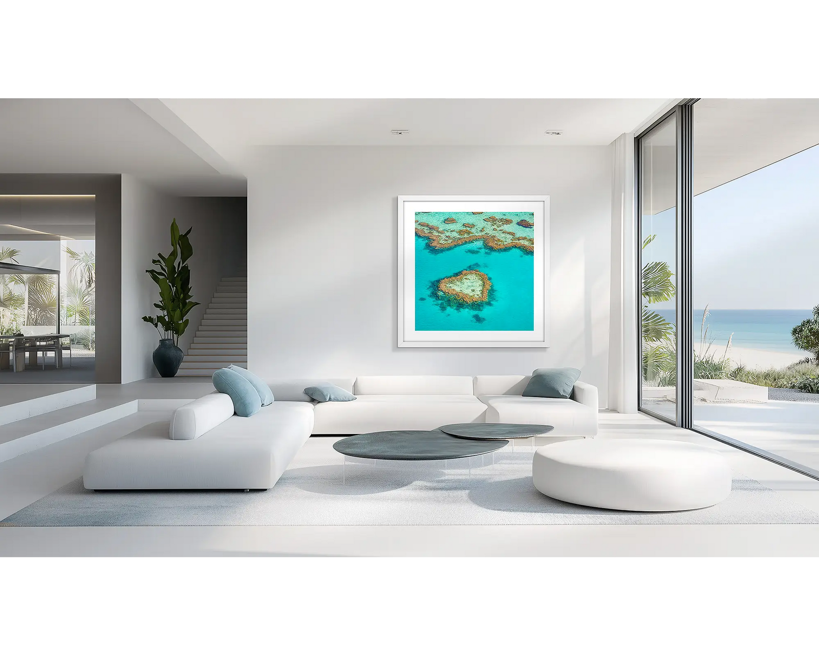 Framed artwork of a heart-shaped coral reef in clear blue water.