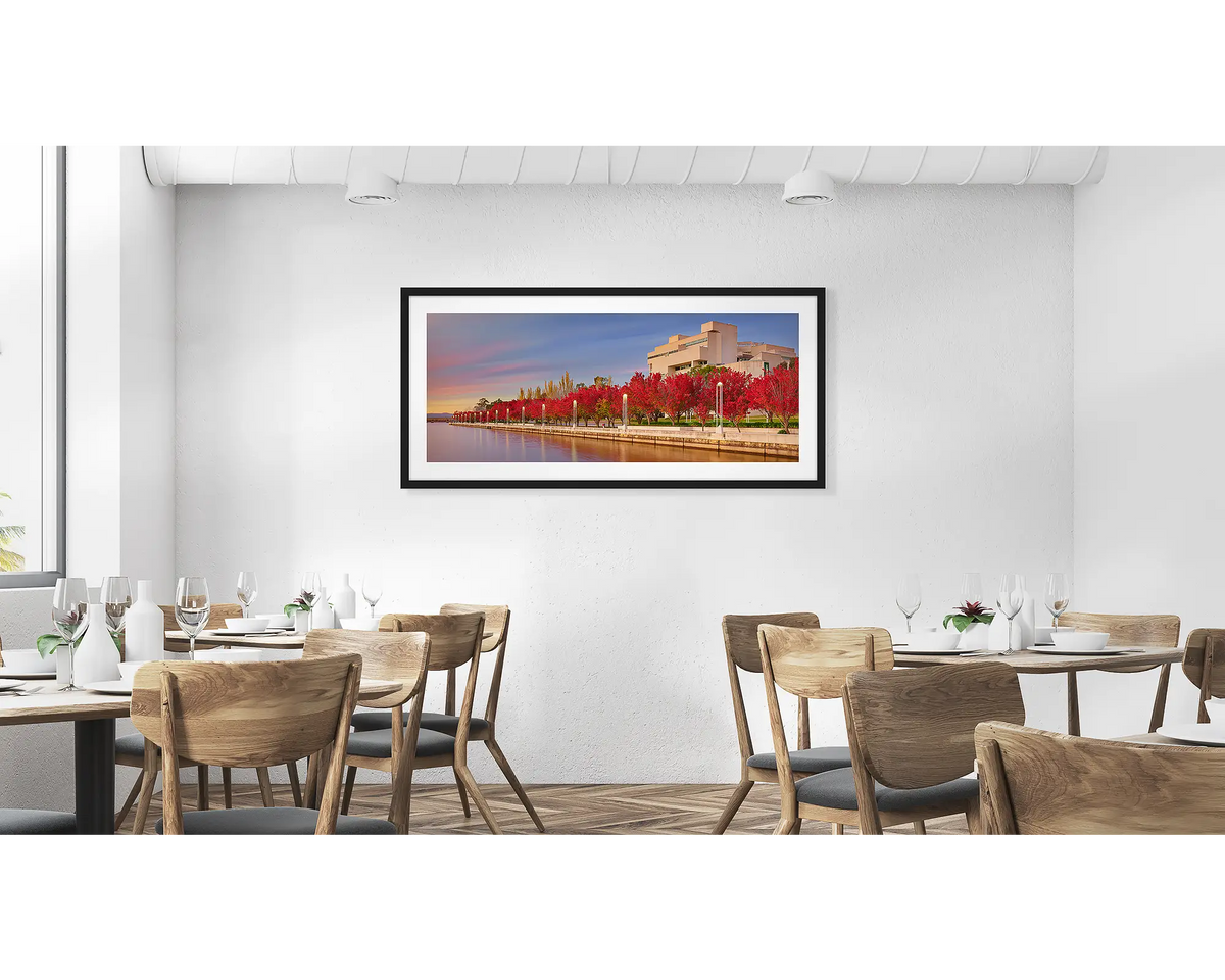The High Court.  Wall art print with black frame of the High Court of Australia with red trees hung in a cafe.