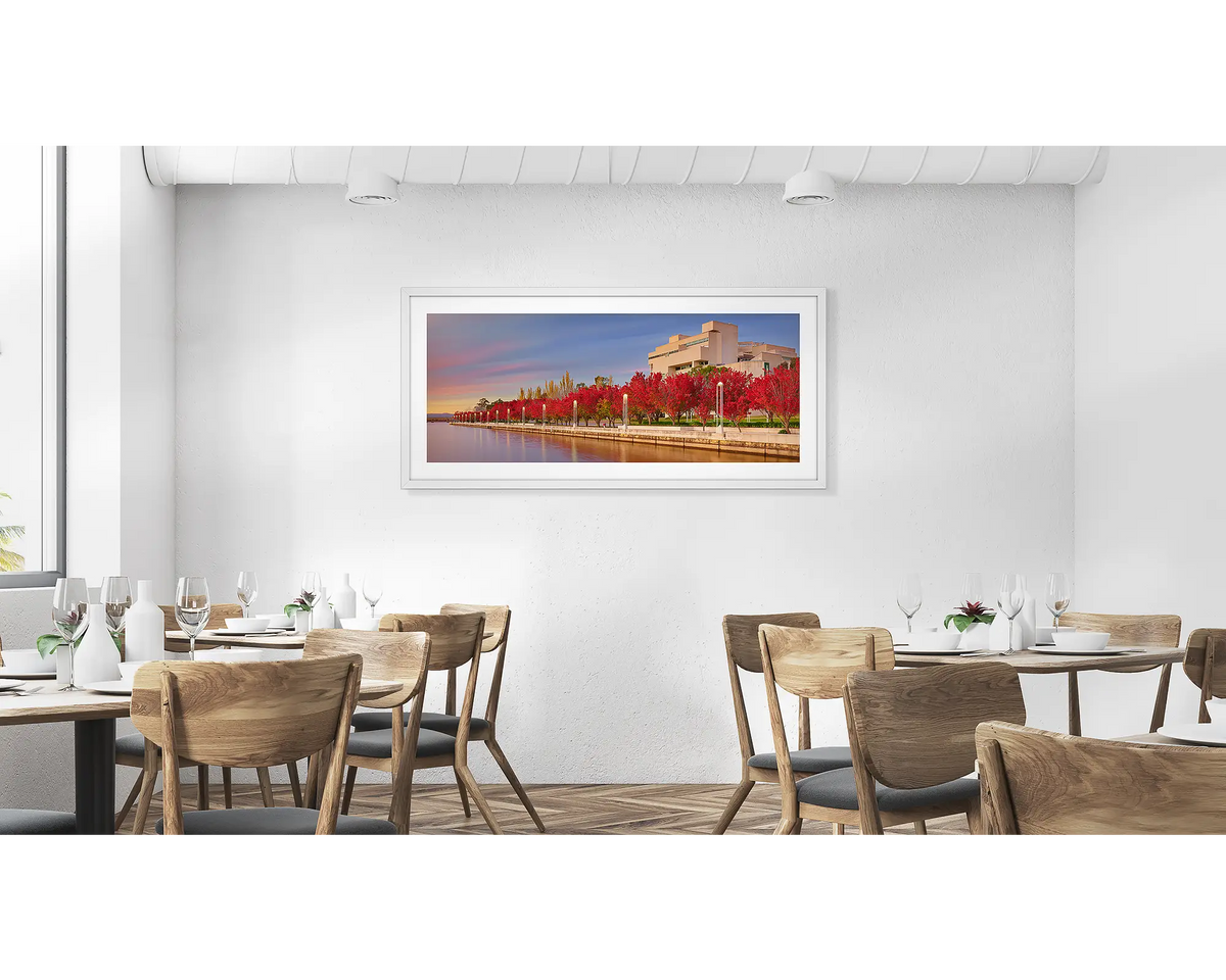 The High Court.  Wall art print with white frame of the High Court of Australia with red trees hung in a cafe.