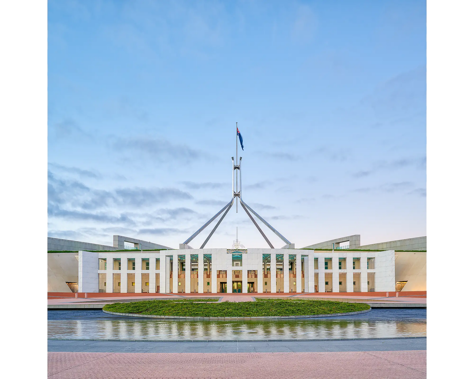 The Hill acrylic block displayed on a desk. Photograph of Australian Parliament House, Canberra, ACT. 