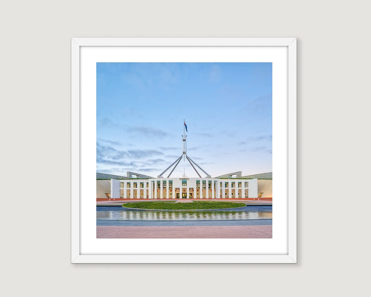 Framed photograph of Australian Parliament House against a blue sky.