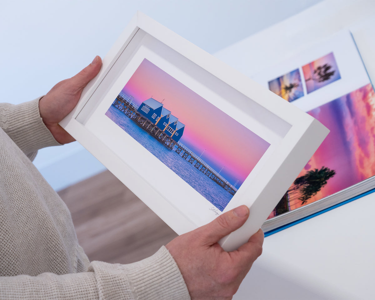 The Jetty. Busselton jetty at sunrise small print with white frame, hand held in gallery.