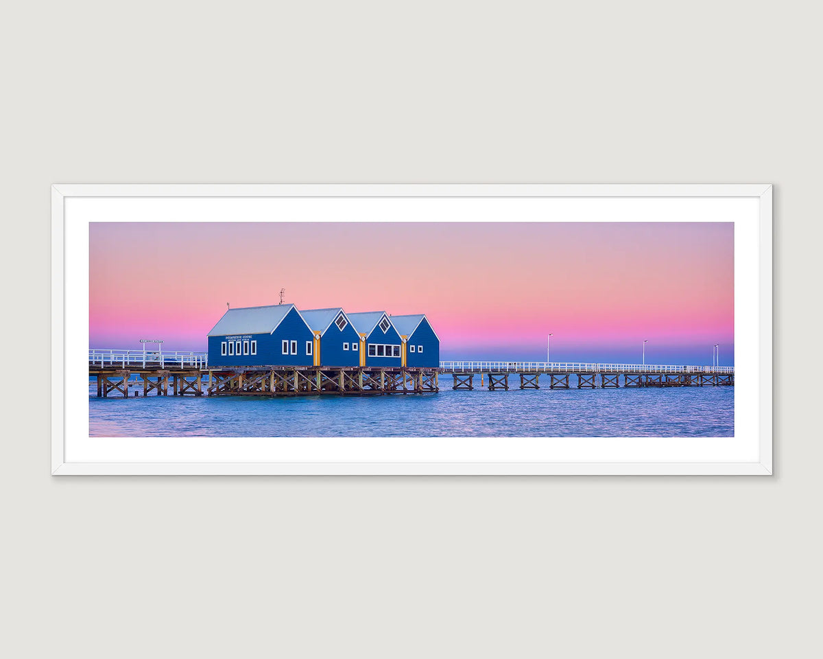 Framed artwork of Busselton Jetty, on a pier with a pink and purple sky.