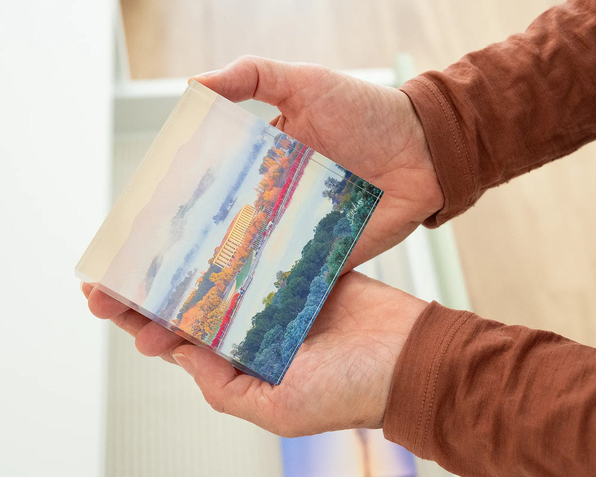 The Library. Acrylic block of the National Library of Australia Canberra, held in hands.