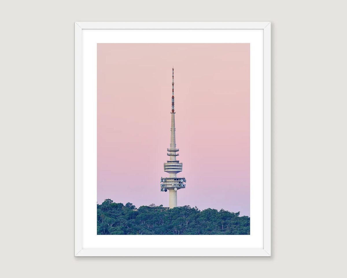 Framed artwork of Telstra Tower against a pink sky with green trees below
