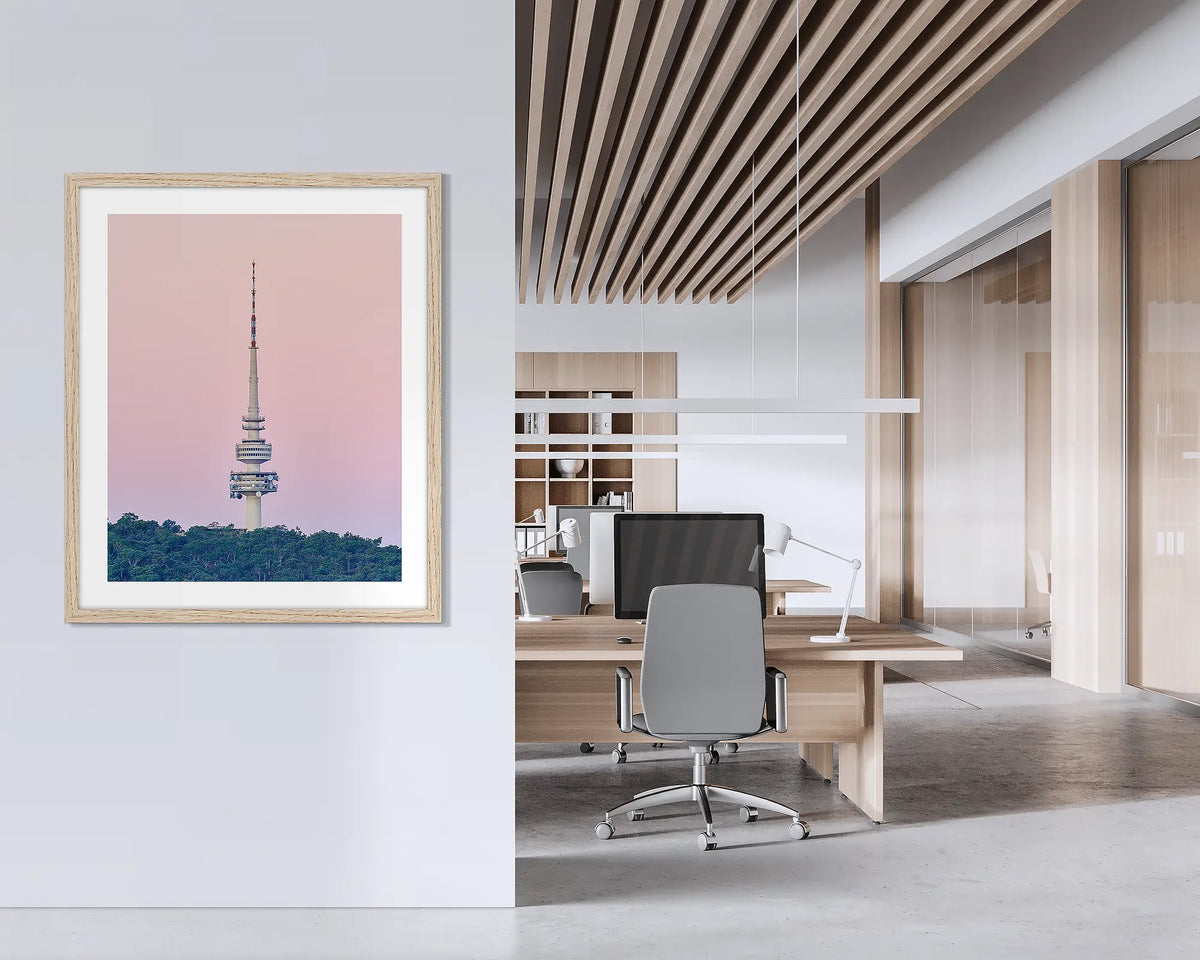 The Needle. Framed wall art print of Black Mountain Tower, with a timber frame, hung on an office wall. 