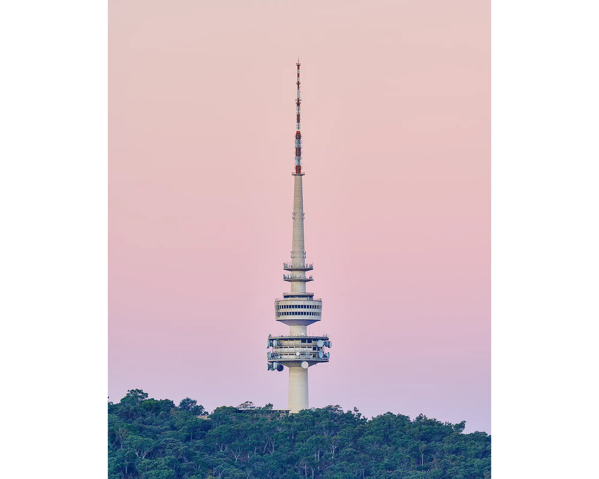 The Needle - Telstra Tower on Black Mountain with pink sunset in Canberra.