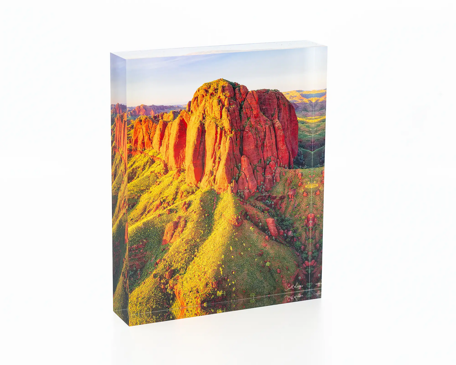 The Rock acrylic block displayed on a desk. 