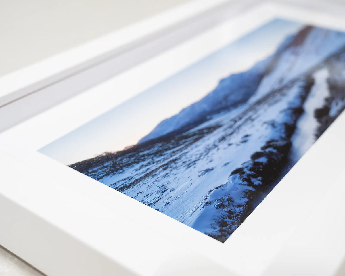 Thredbo Colours. Close-up detail of small framed print of sunset over Thredbo river.
