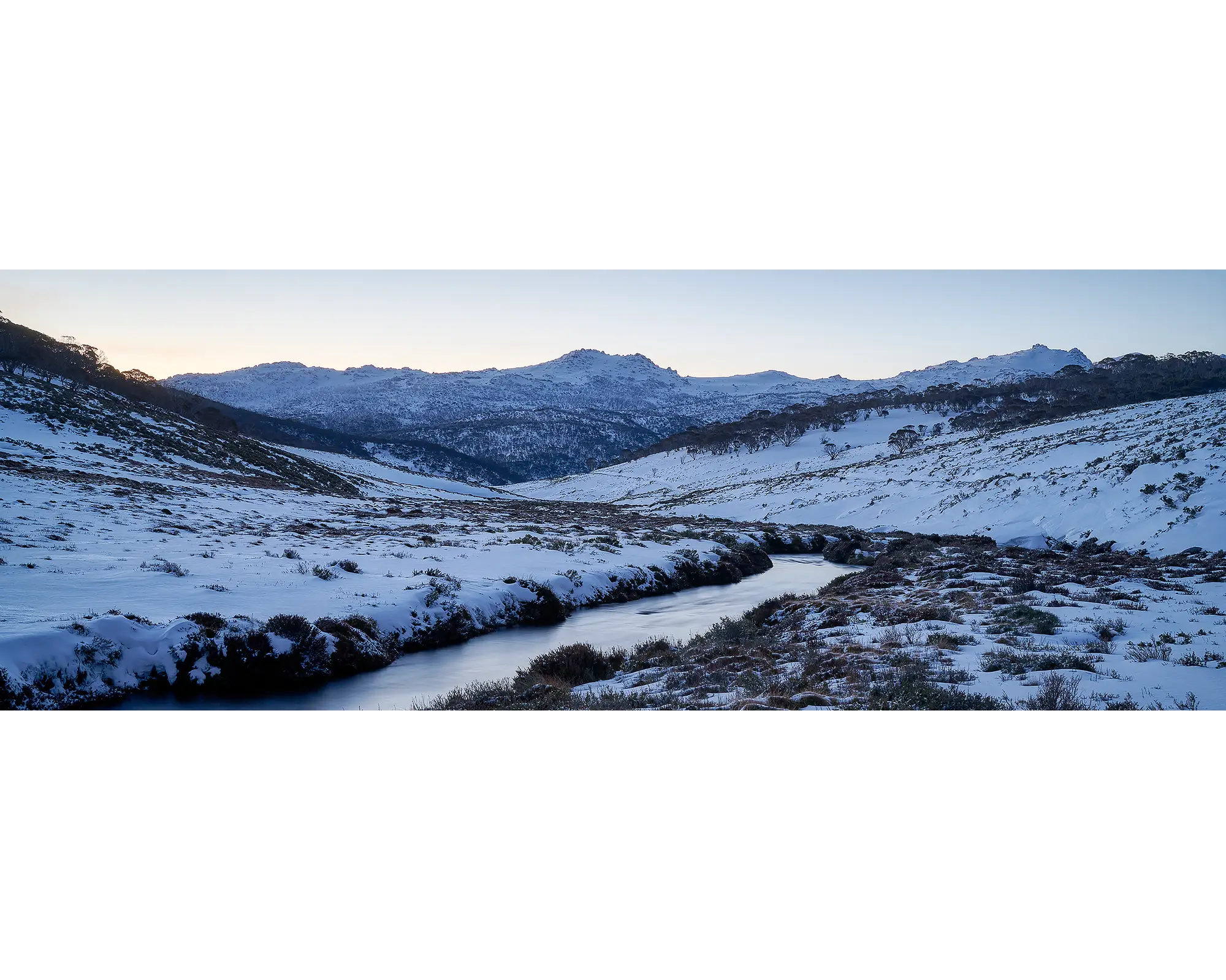 Thredbo Colours. Sunset over the Thredbo River and Rams Head Range with winter snow.