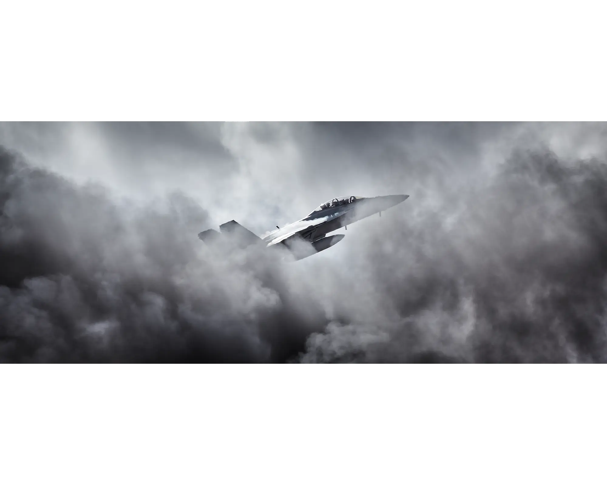 Australian Aior Force F/A-18F Super Hornet flying through clouds.