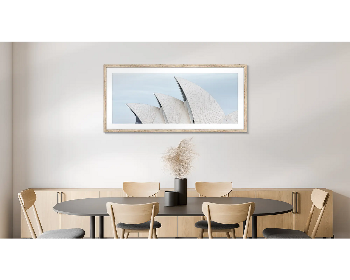 Tile Geometry. Wall art print of the Sydney Opera House, with a timber frame, hung in an office kitchen area. 
