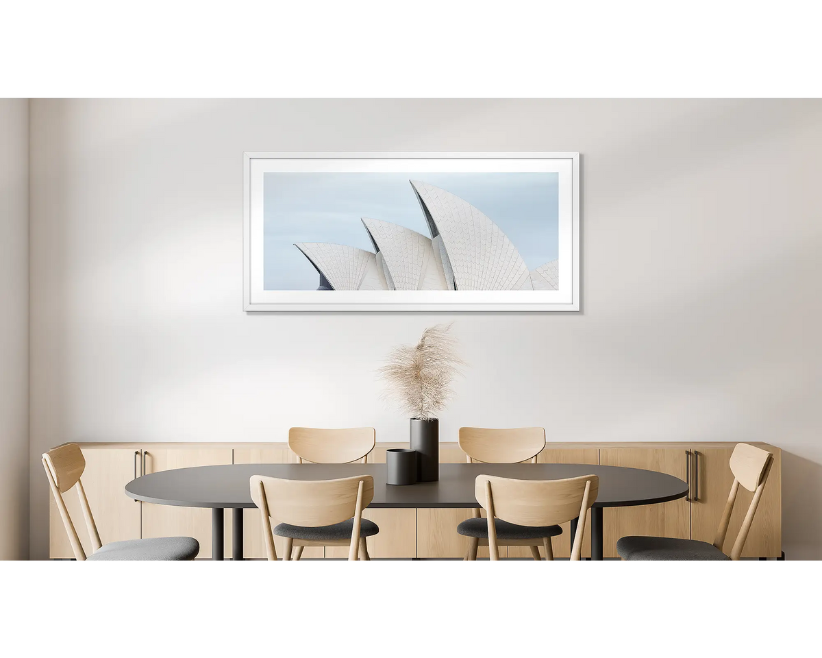 Tile Geometry. Wall art print of the Sydney Opera House, with a white frame, hung in an office kitchen area. 