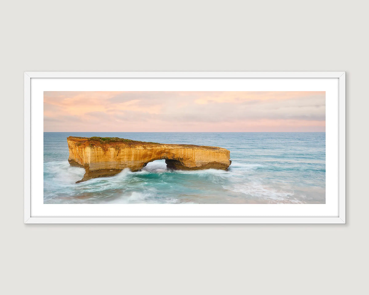 Framed artwork of London Bridge, a natural rock formation, on the Great Ocean Road with ocean and sky.