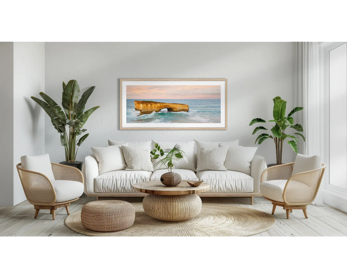 Time Out. Large wall art print of London Bridge, with a timber frame, hung above a couch. 