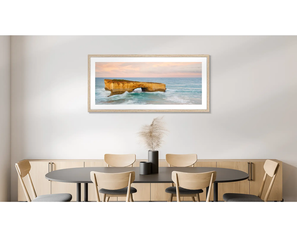 Time Out. Large wall art print of London Bridge, with a timber frame, hung in a dining room. 