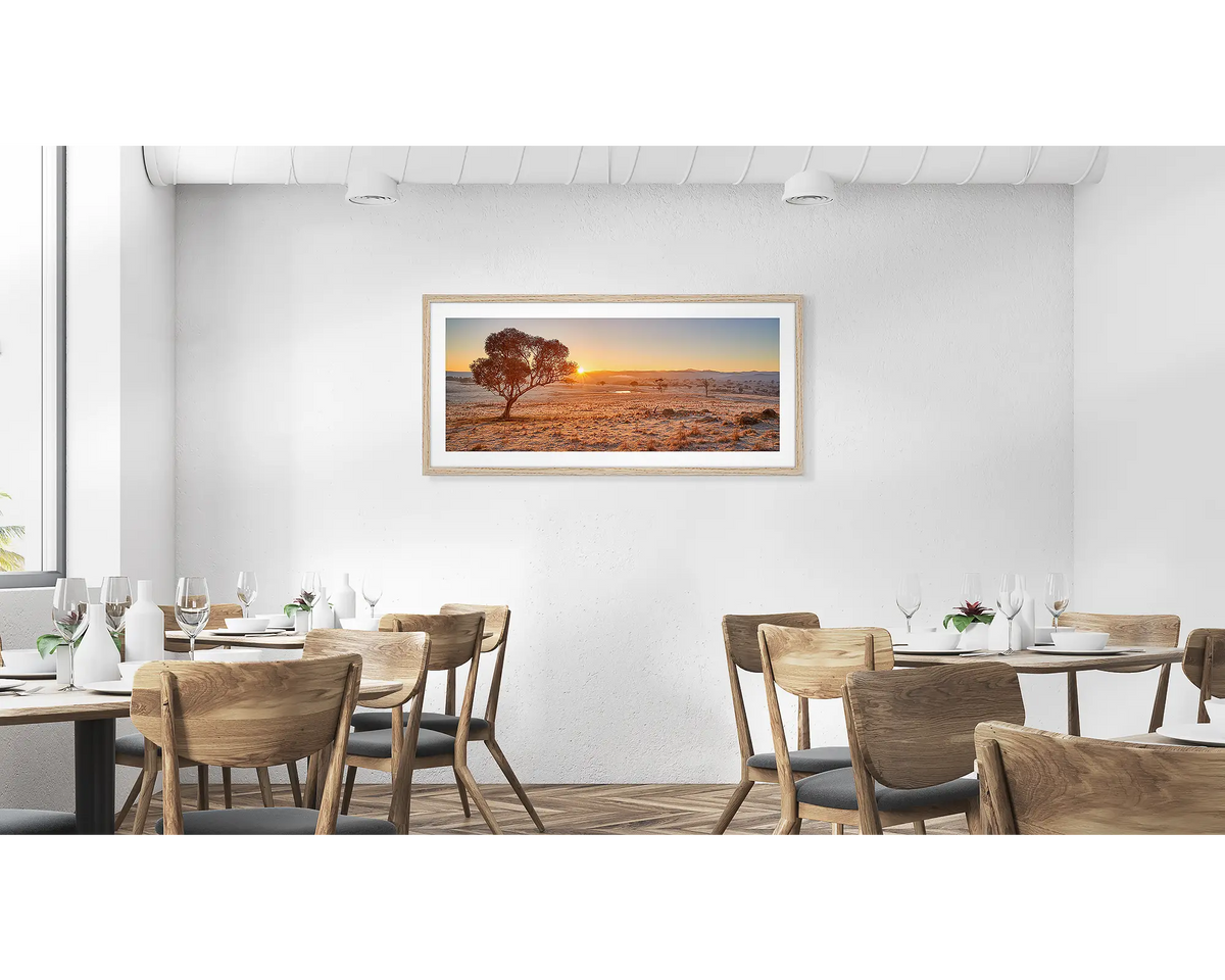 Touching the Sun. Googong Sunrise wall art in a timber frame hung in a cafe. 