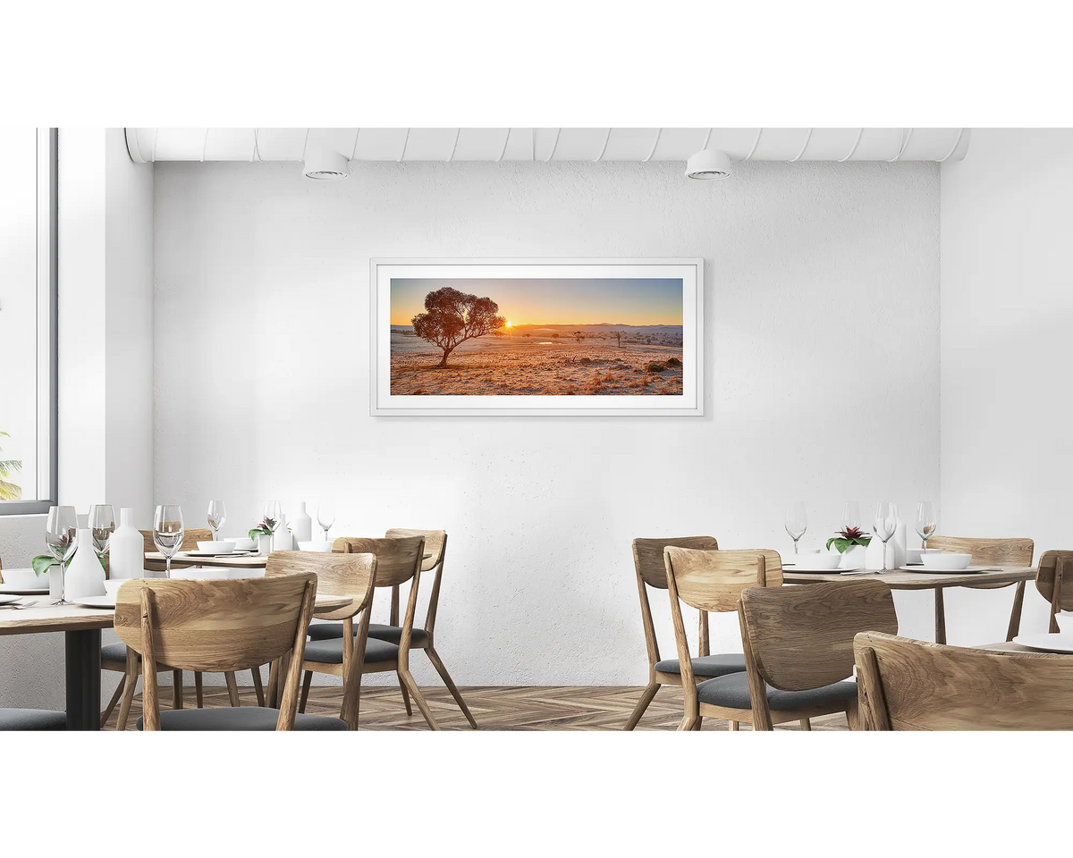 Touching the Sun. Googong Sunrise wall art in a white frame hung in a cafe. 