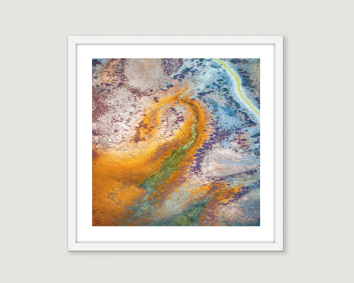 Framed abstract art print with colourful patterns on a light grey background.