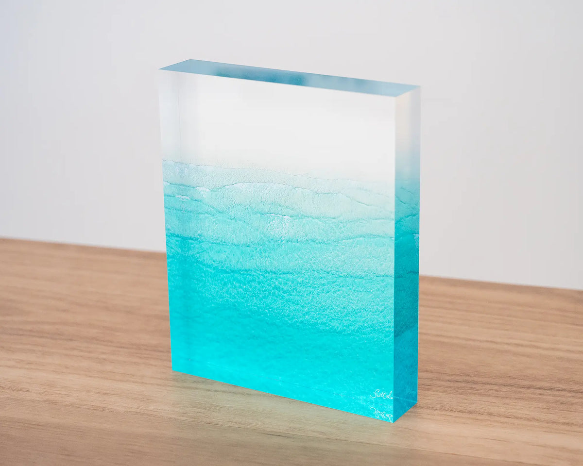 Tranquility. Acrylic block of Whitehaven Beach, Queensland, sitting on a desk.