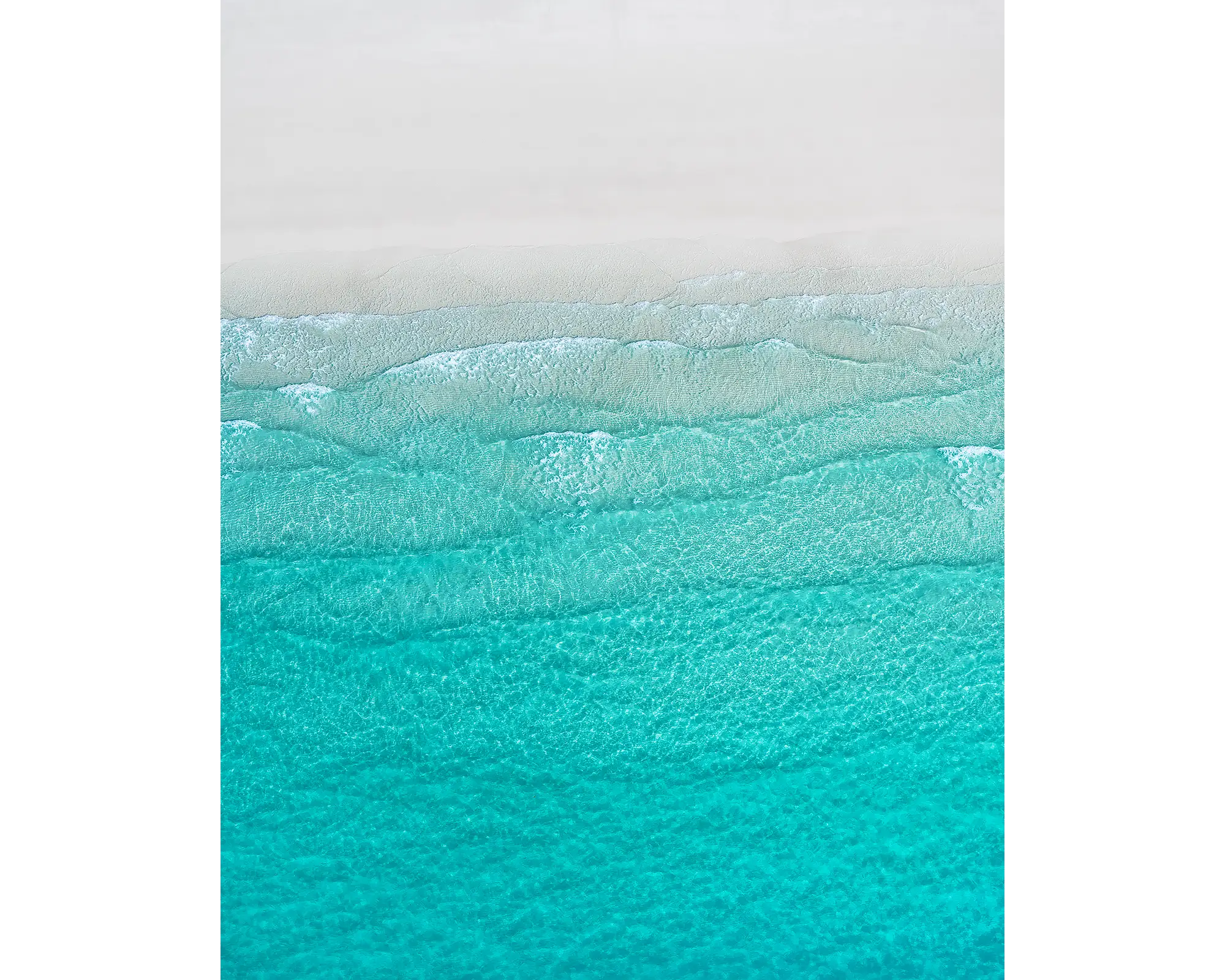Tranquility - Aerial view of waves and white sand at Whitehaven Beach, Whitsunday Island, Queensland, Australia.