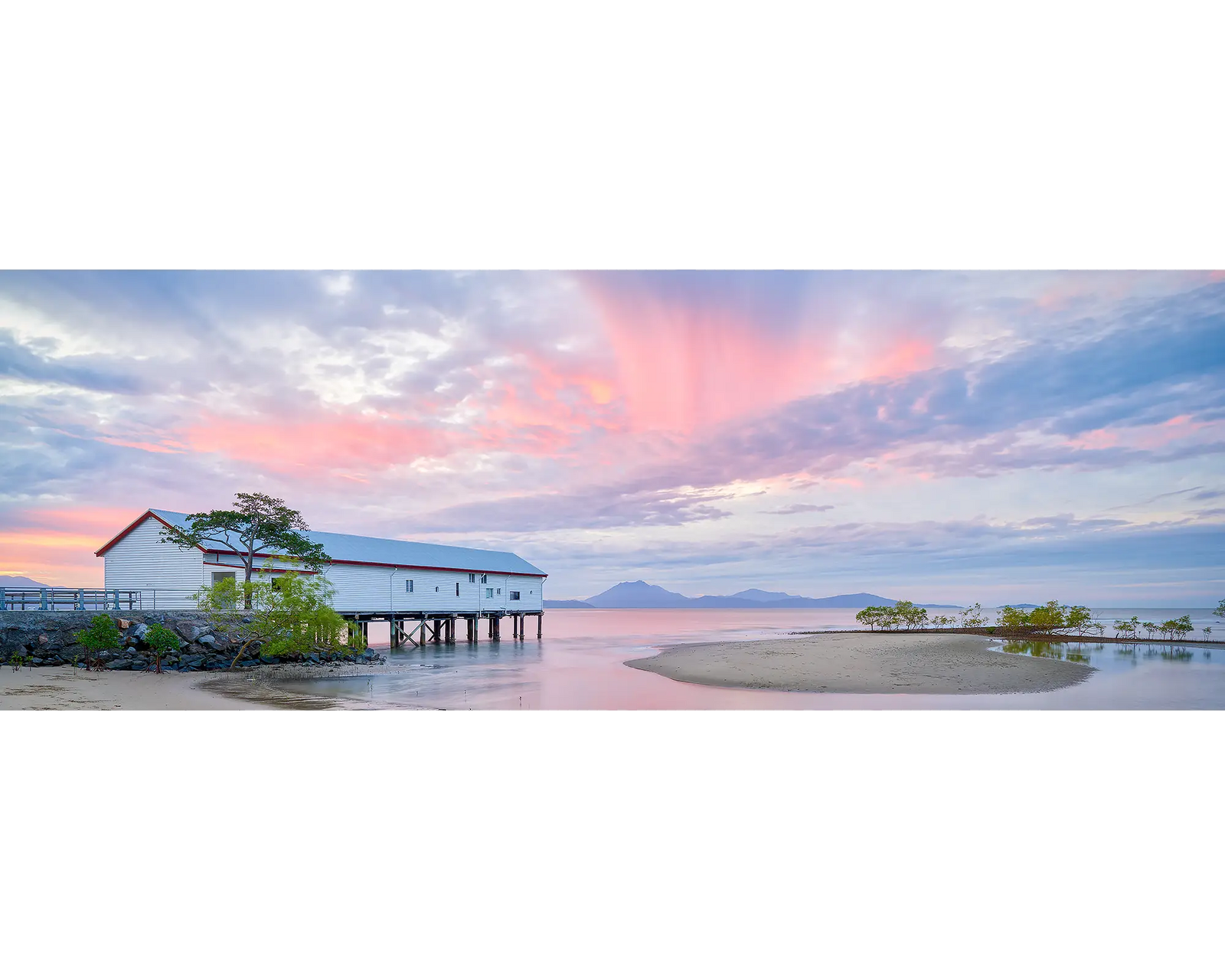 Sugar Wharf, Port Douglas, Queensland with pink sunset.