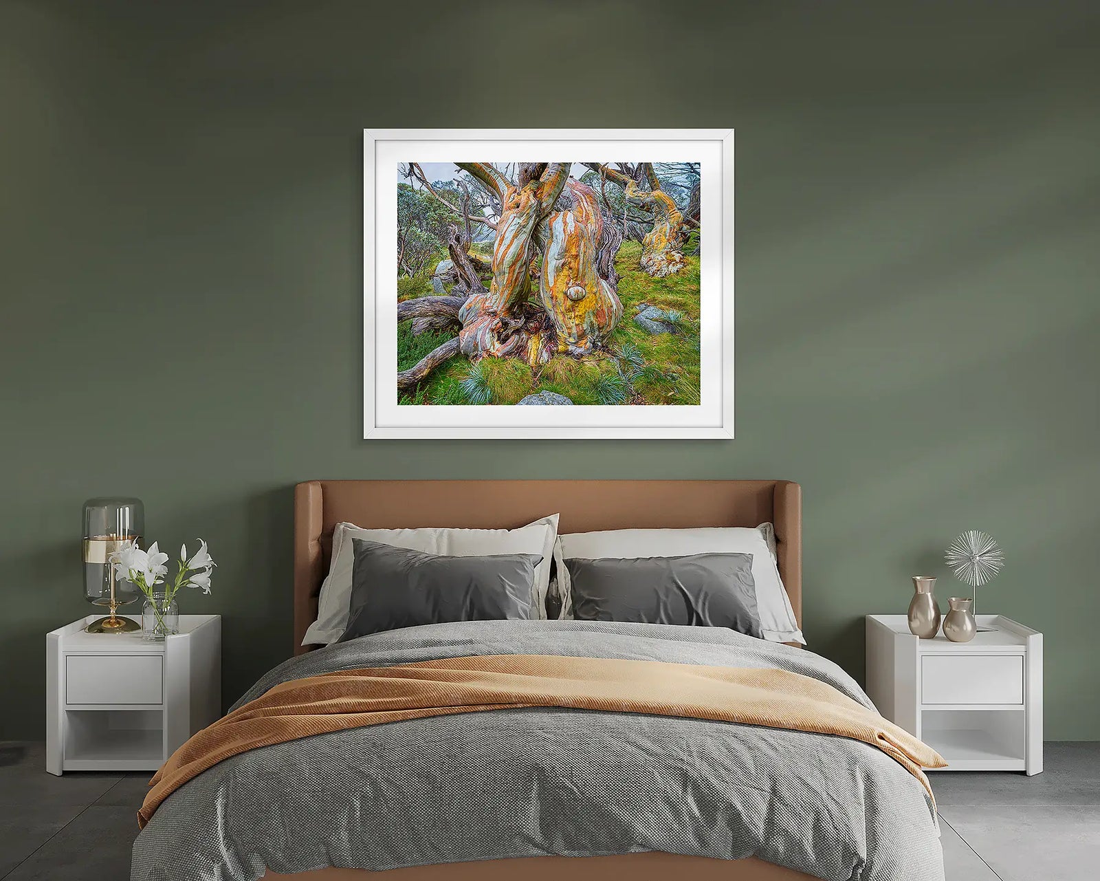 Framed artwork of a large snow gum tree with colourful bark on a grassy background.