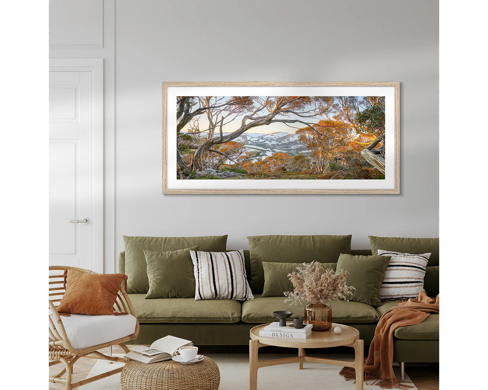 Framed artwork of a scenic landscape towards Twynams Peak with trees and mountains.