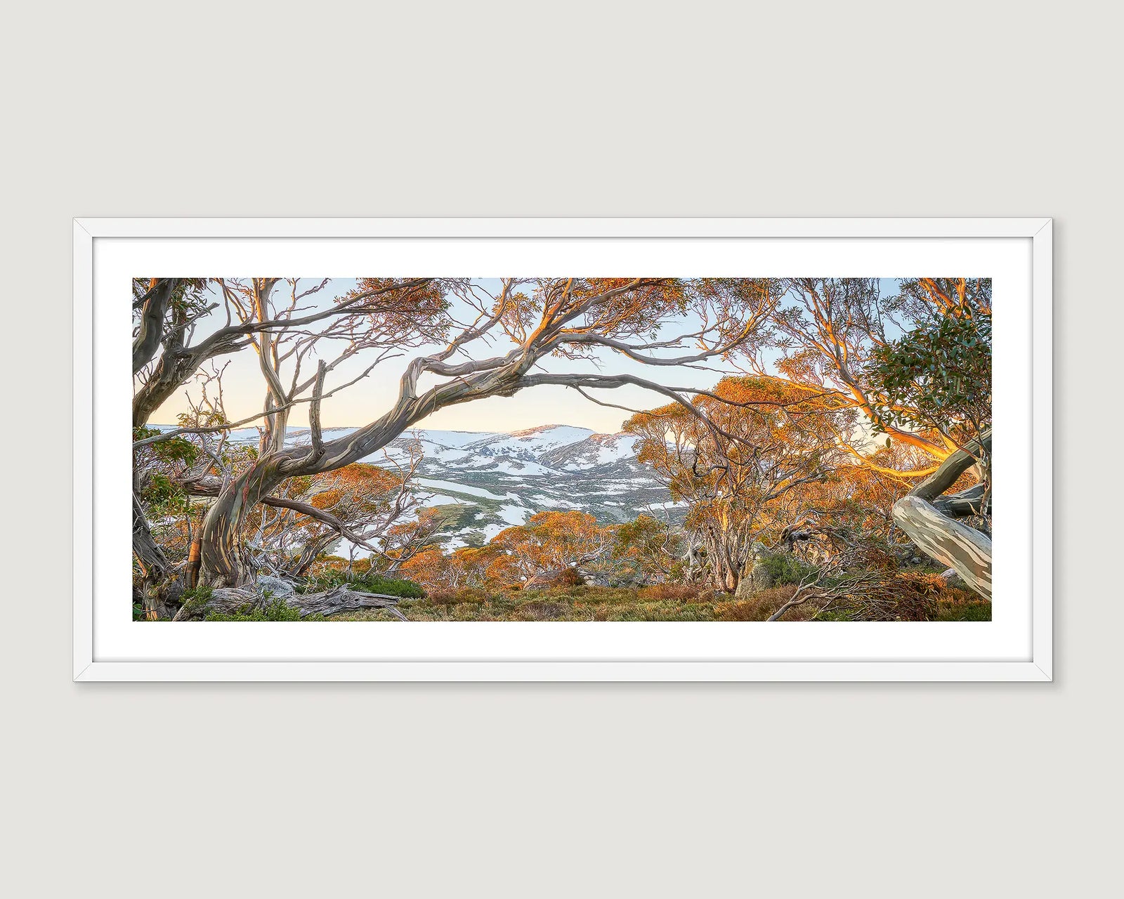 Framed artwork of a scenic landscape towards Twynams Peak with trees and mountains.