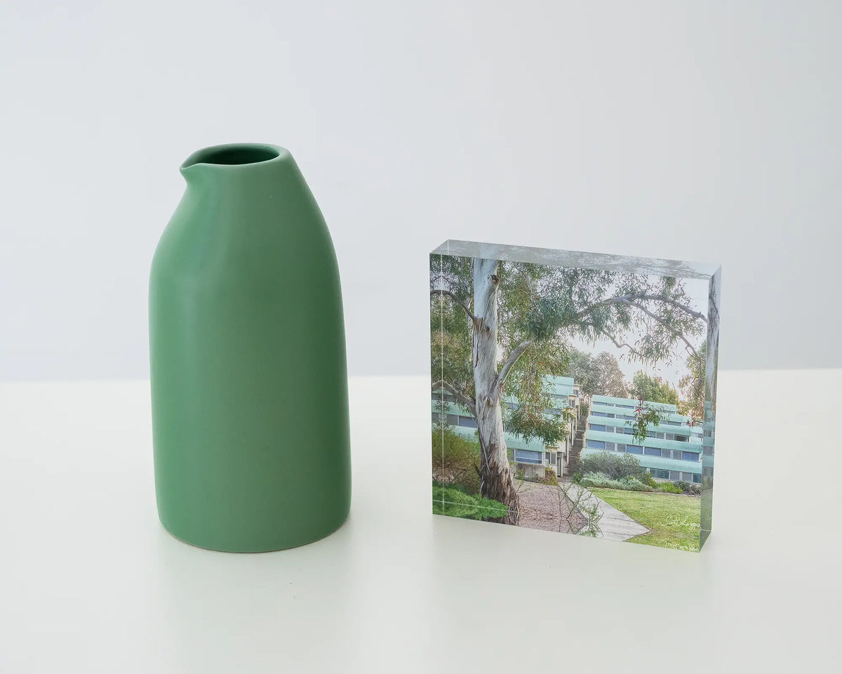 University Of Canberra 6. Acrylic block styled with a small vase.
