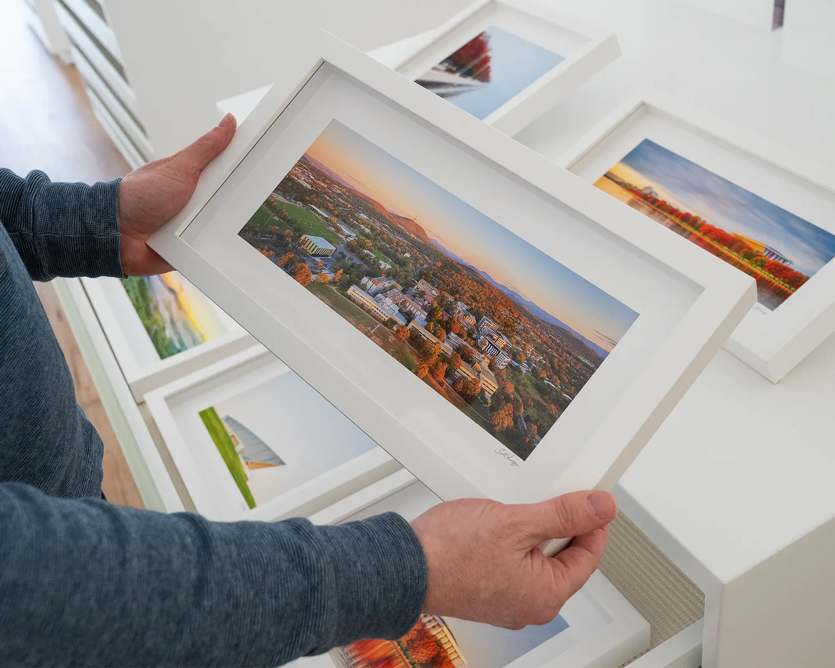 University Sunset. University of Canberra at sunset small framed print, being hand held.