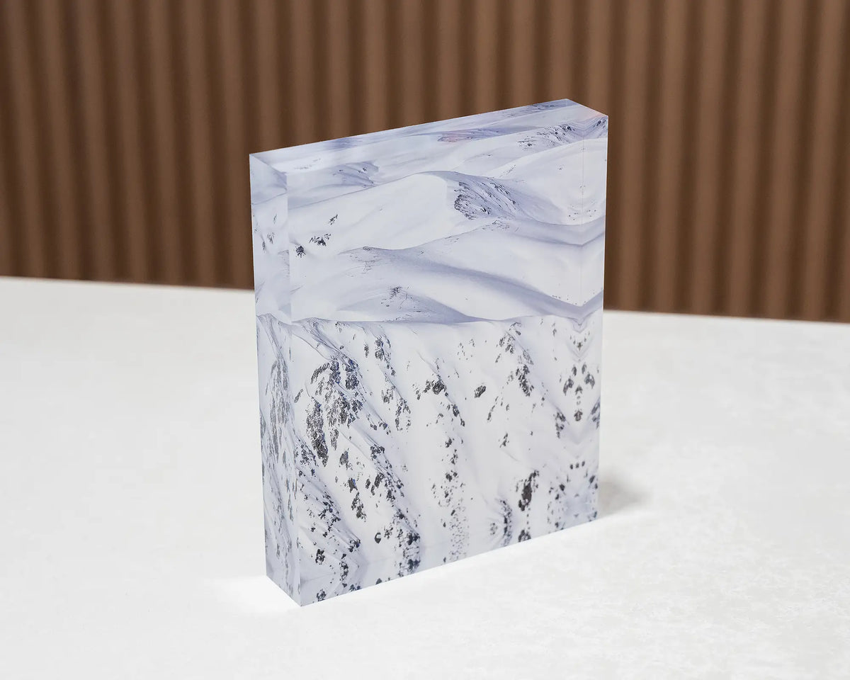 Unveiled. Acrylic block of Main Range, Kosciuszko National Park, sitting on a desk.
