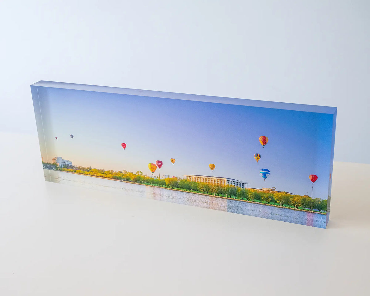Upwards. Acrylic block of hot air balloons over the National Library of Australia, Canberra.