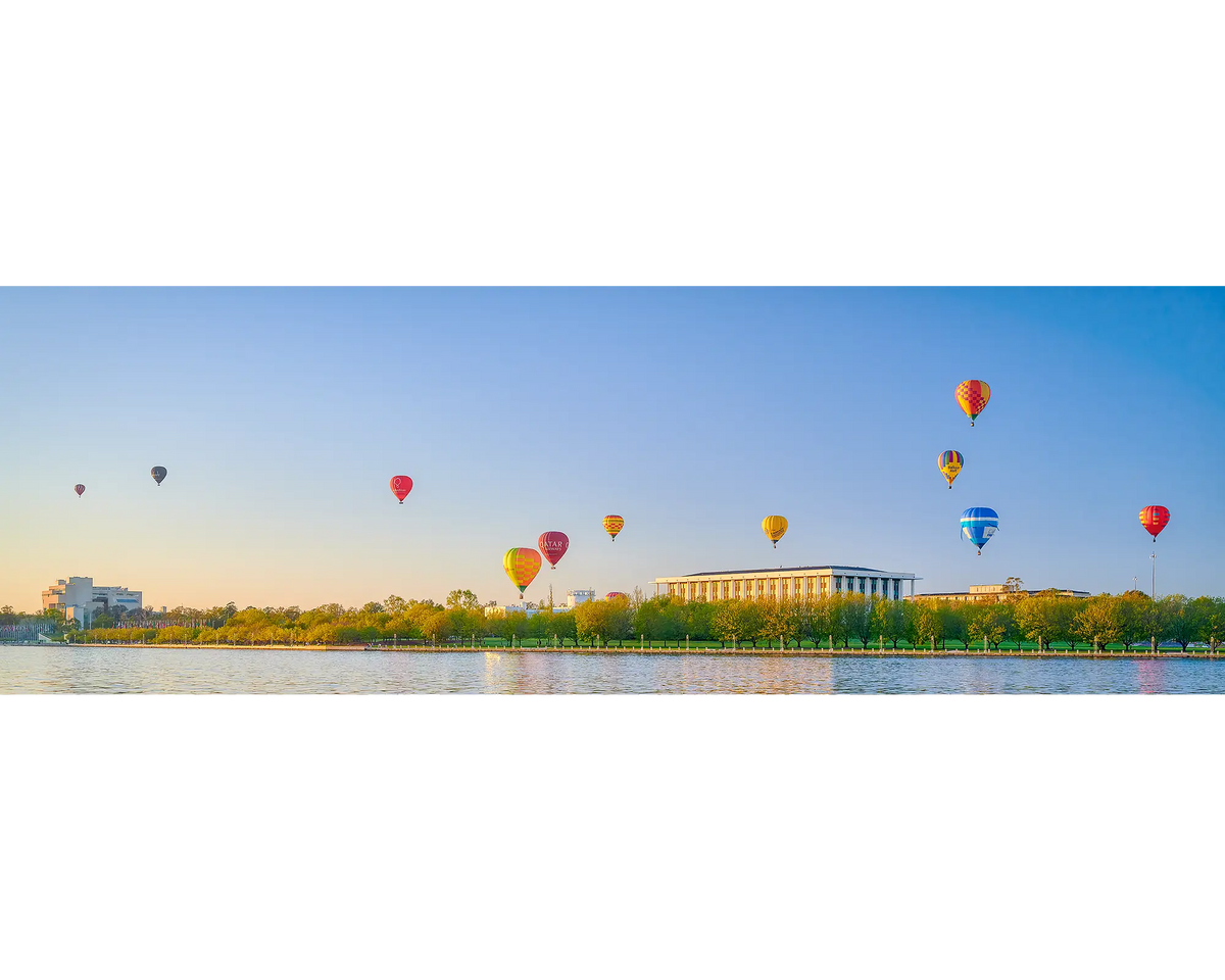 Upwards - Balloons over National Library at sunrise during Balloon Spectacular, Vivid Festival, Canberra.