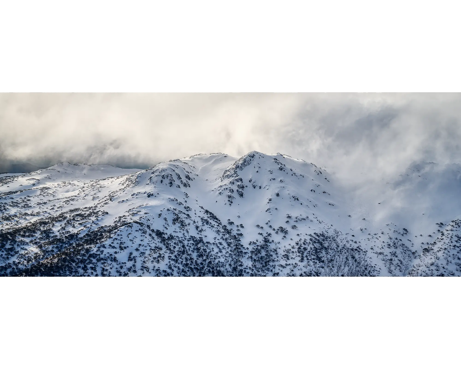 Veil of the Alps. Twin humps with snow and fog, Kosciuszko National Park. 