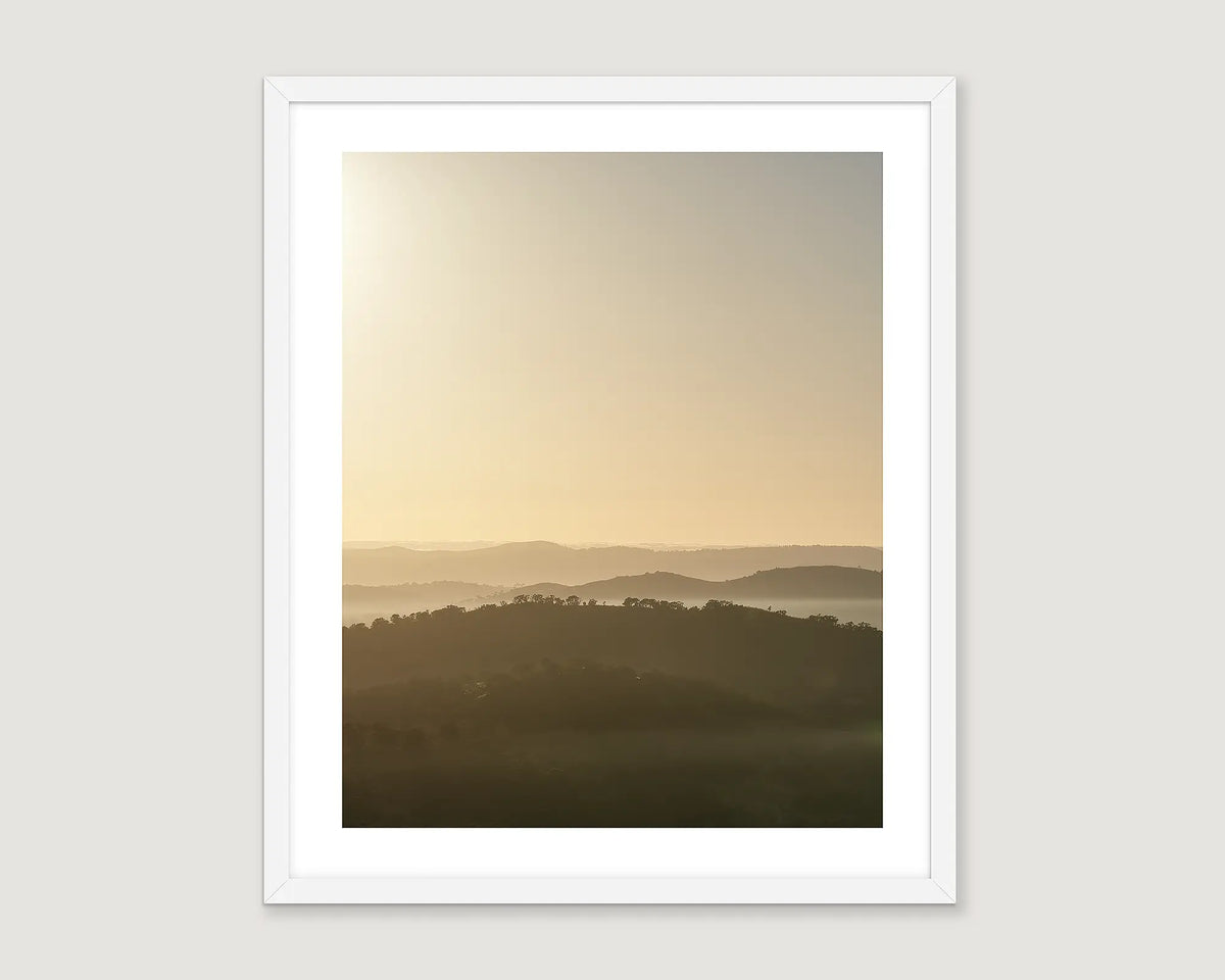 Framed artwork of a landscape featuring Farrer Ridge and Wanniassa Hills Nature Reserves at sunrise.