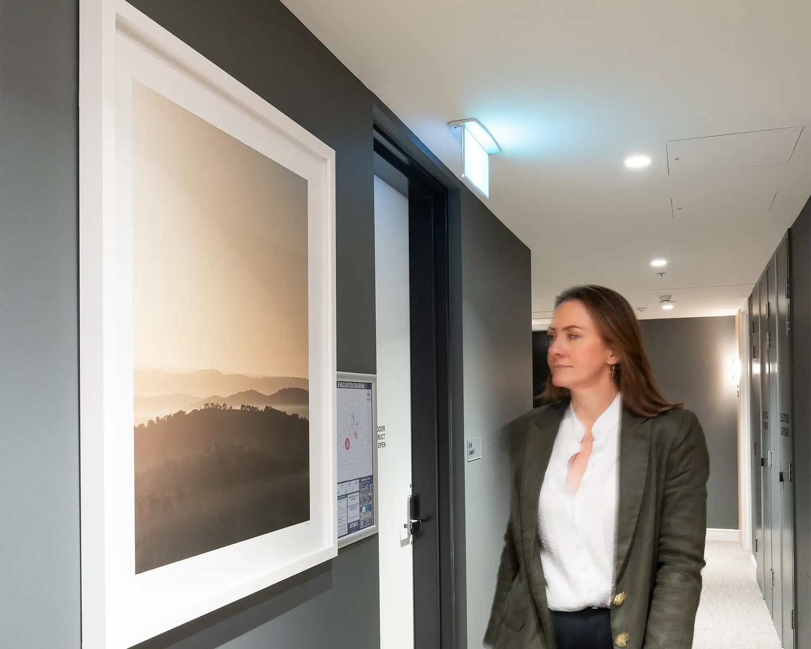 Framed artwork of a landscape featuring Farrer Ridge and Wanniassa Hills Nature Reserves at sunrise.