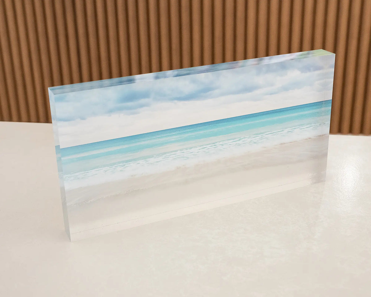 Washed. Acrylic block of Geographe Bay, Western Australia, sitting on a desk.